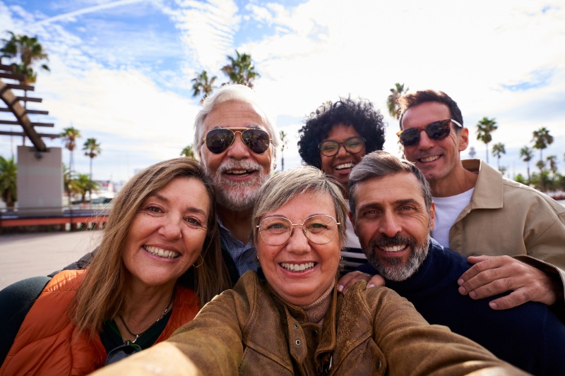 group of mature people taking a selfie